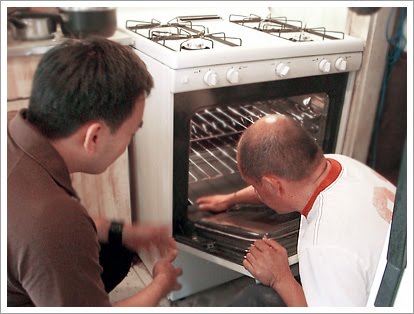 Toan and Jorge Munoz checking out his new oven.