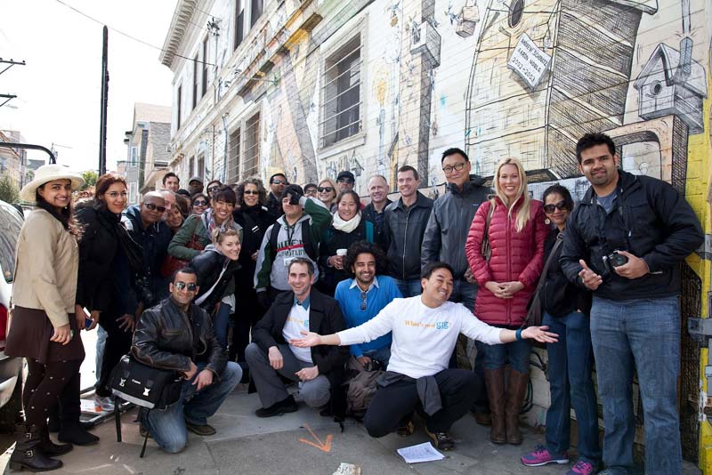 Go Inspire Go's photo flash mob walk participants pose in San Francisco.