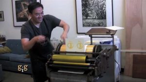 Toan making thank you cards with a letterpress