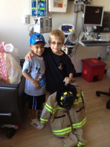 Nico Castro passing out Halloween costumes to friends at the hospital