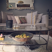 Living room with alpaca rug and candles