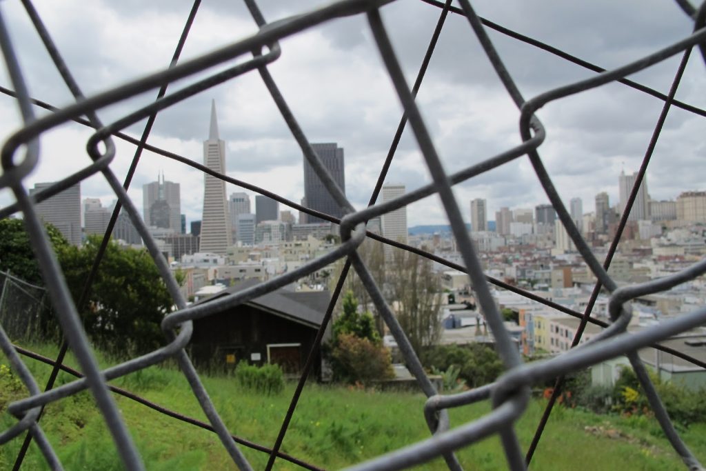 View of the Transamerica Pyramid through a chain-link fence